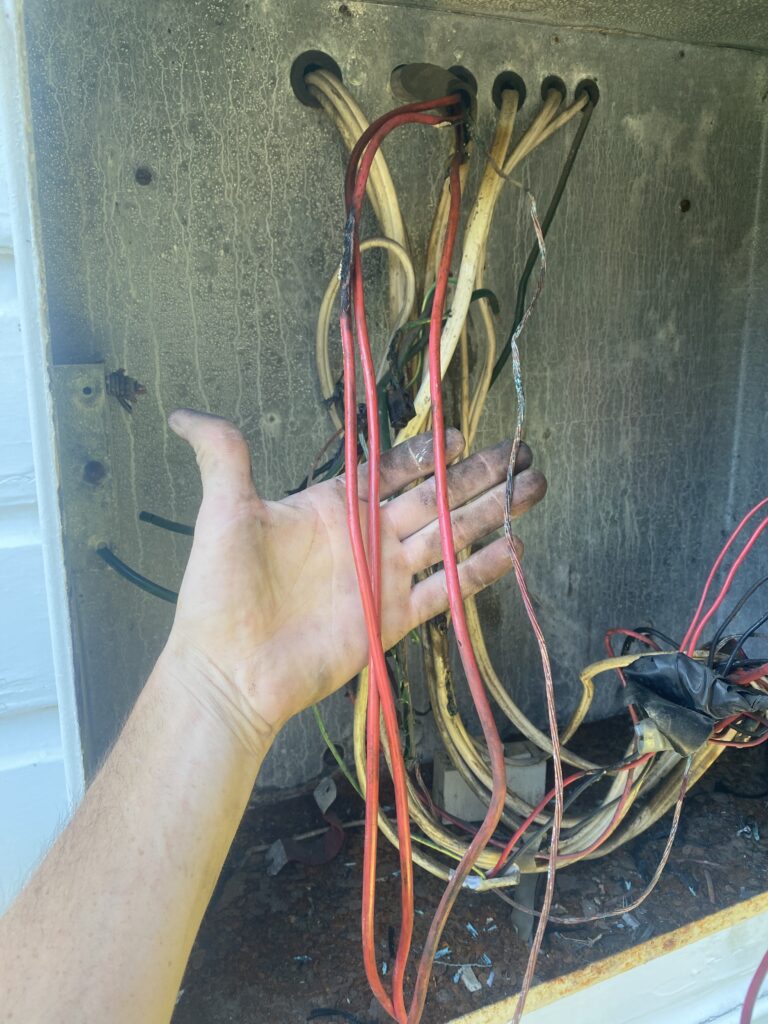 Close-up of messy electrical wires and connections.