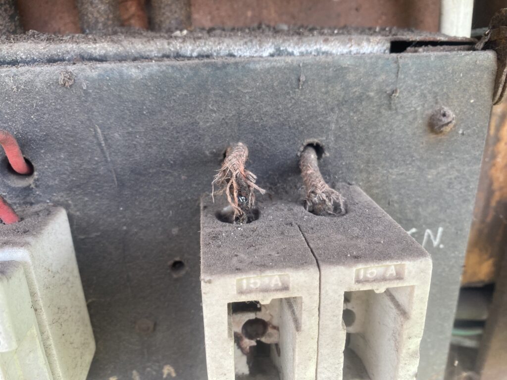 Worn electrical connections with dust buildup.