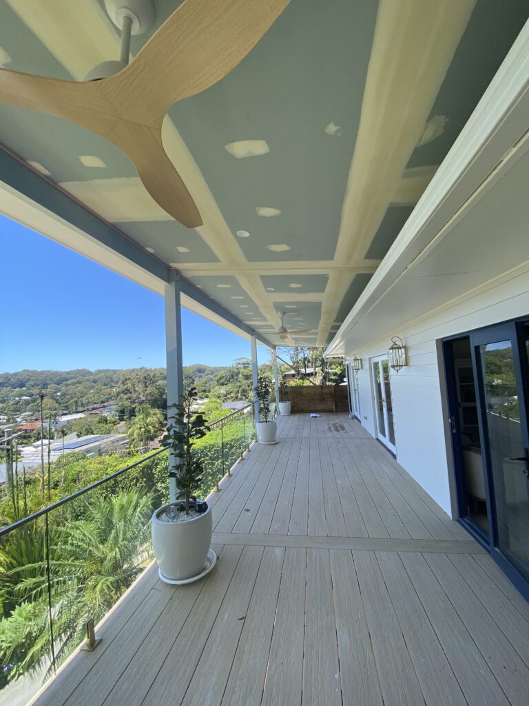 Spacious balcony with view and modern decor.